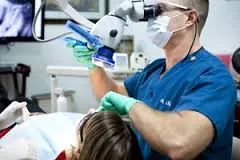 A photo of Dr. Lea performing a root canal at Coastal Endodontics